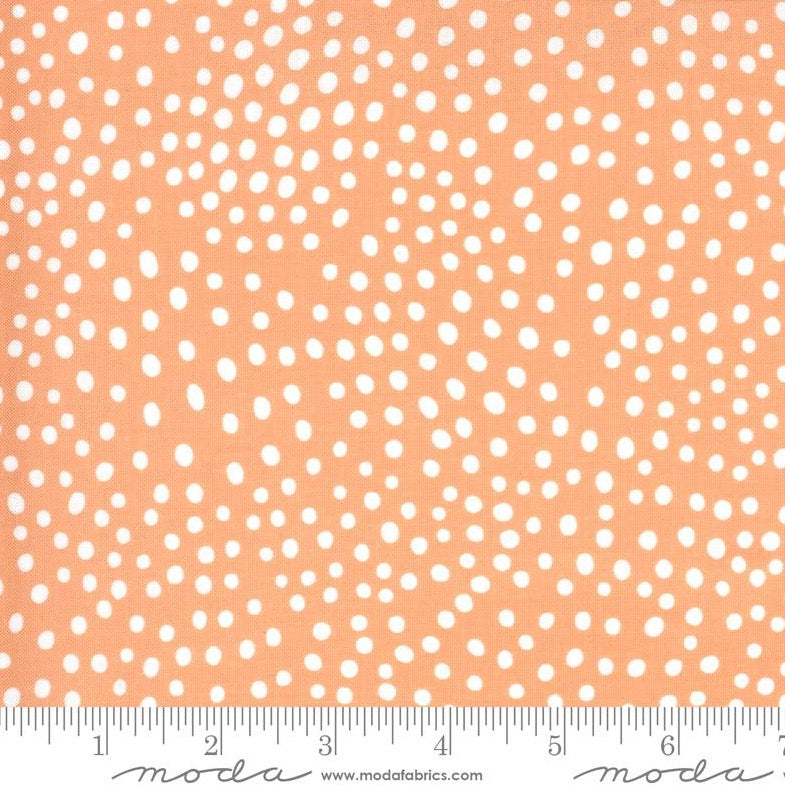 printed cotton peach pink with white spots medium weight fabric