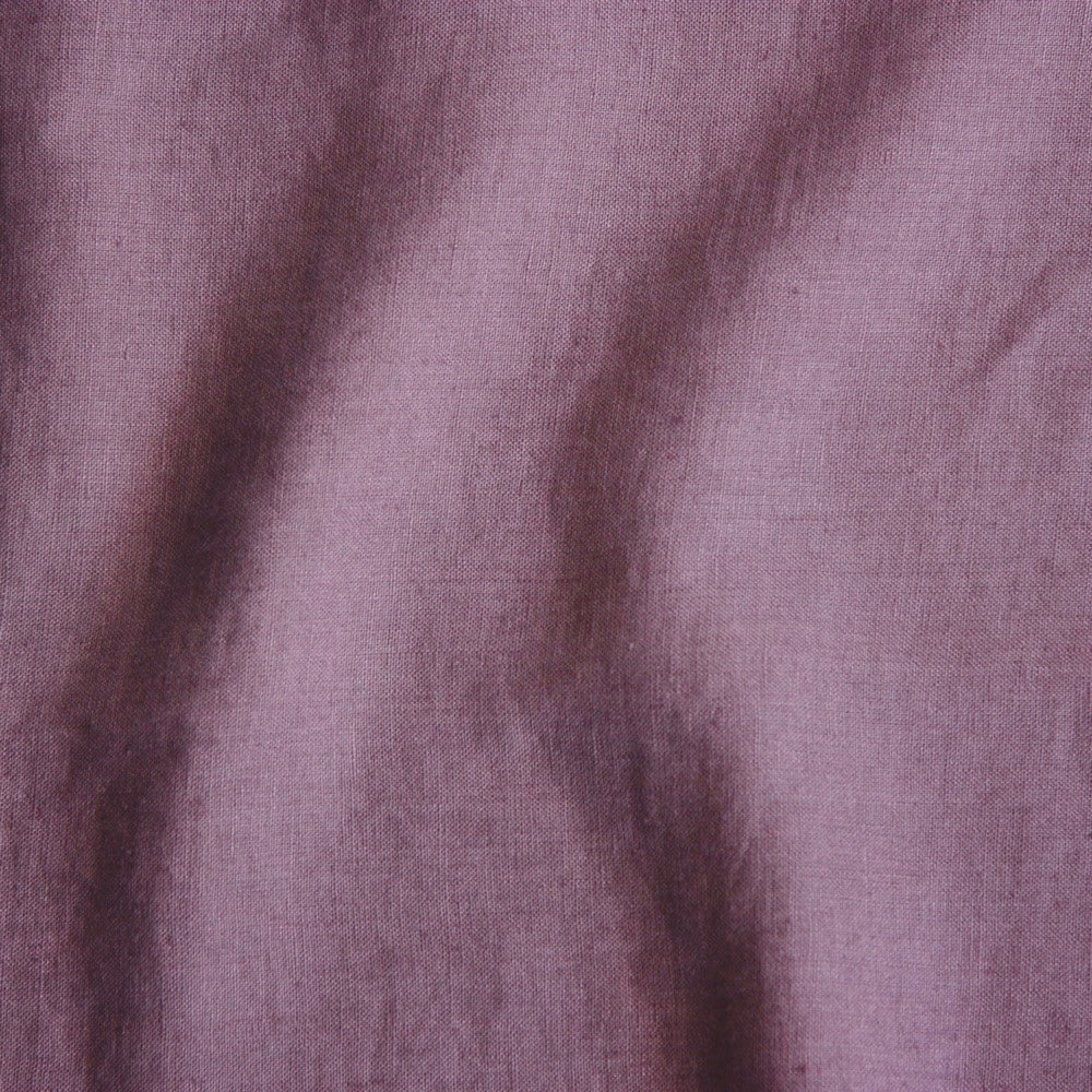 faded purple coloured and washed european linen fabric