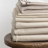 pile of folded organic cotton fabric natural