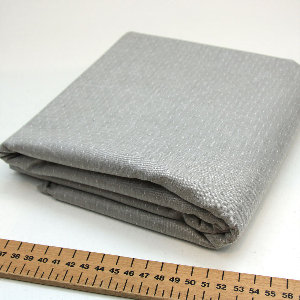 silver grey woven cotton fabric with tiny dot stitched detail