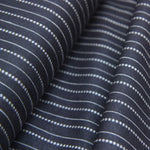 Woven black cotton fabric with stitched stripe detail 