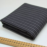 Woven black cotton fabric with stitched stripe detail 