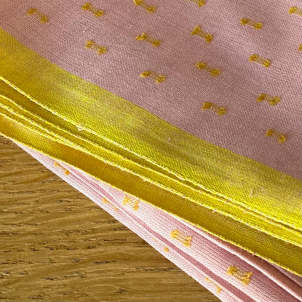 Printed pink and yellow cotton fabric