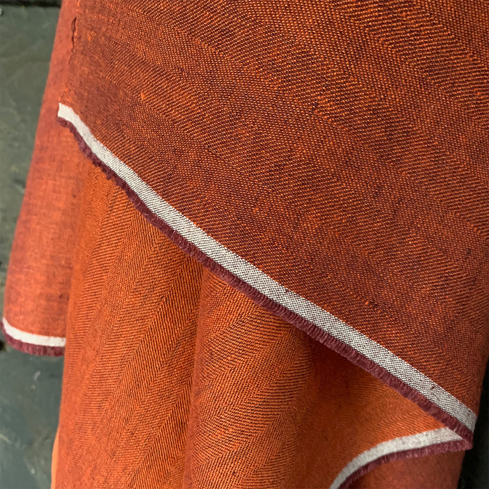 soft washed orange linen herringbone weave draping fabric