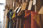 rolls of coloured and washed european linen fabric