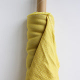 roll of yellow linen gingham fabric