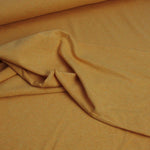 warm yellow melange cotton jersey stretch fabric