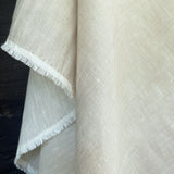 soft washed cream coloured linen herringbone weave fabric draping