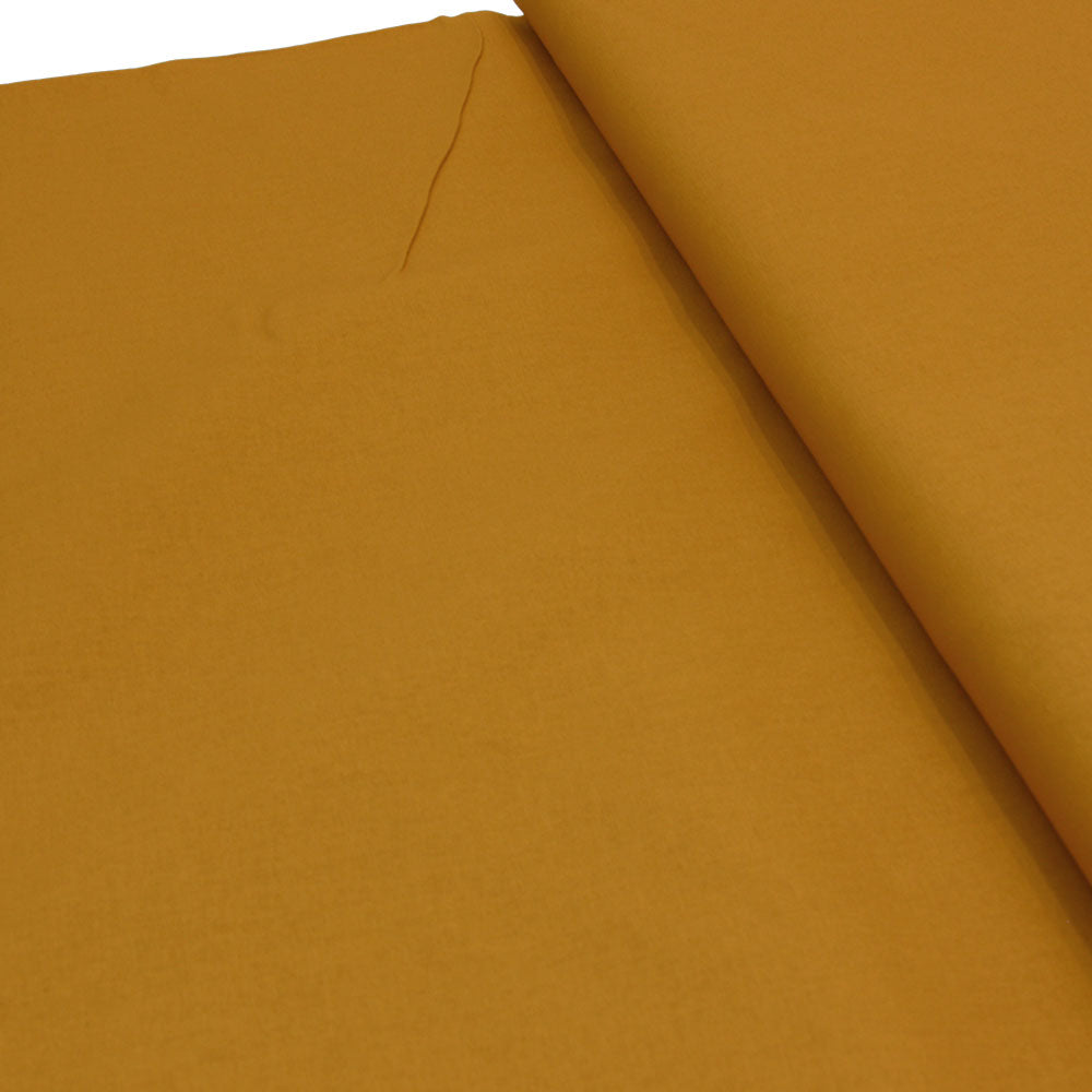 plain wide crisp cotton fabric in ochre yellow