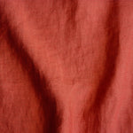 pink orange coloured and washed european linen fabric