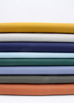 stack of heavy cotton twill fabric