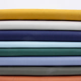 stack of heavy cotton twill fabric