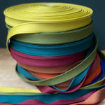 coloured reels of cotton strap webbing
