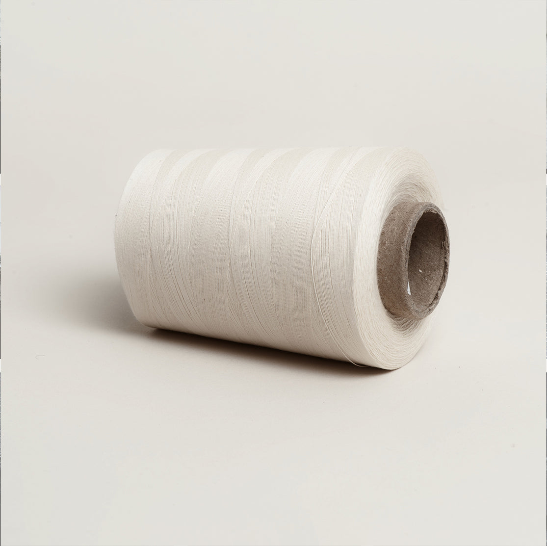 Unbleached Cotton Overlocker Spool on Cardboard Cone