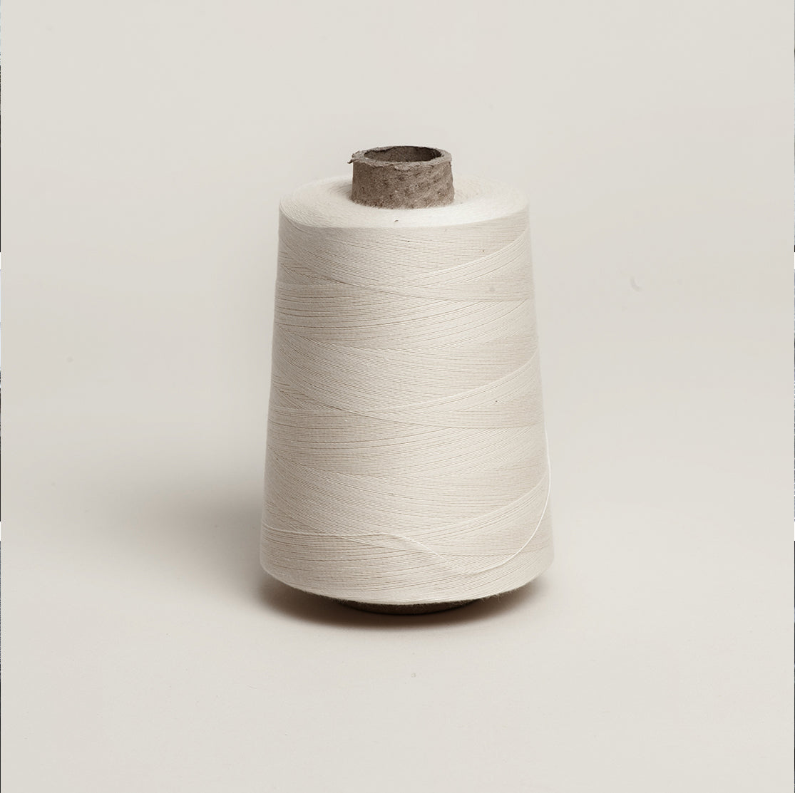 Unbleached Cotton Overlocker Spool on Cardboard Cone